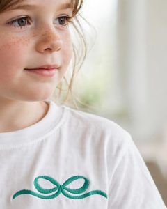 Accent Bow Machine Embroidery Design embroidered on a t-shirt