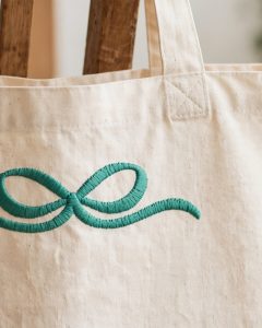 Accent Bow Machine Embroidery Design embroidered on a tote bag