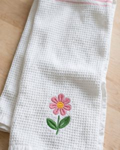 Pink Flower Machine Embroidery Design embroidered on a towel