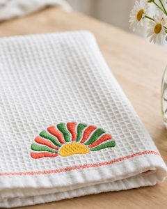 Wavy Sunshine Machine Embroidery Design embroidered on a towel