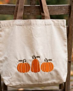 Pumpkin Trio Machine Embroidery Design embroidered on a tote bag