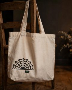 Spider on a Web Machine Embroidery Design embroidered on a tote bag
